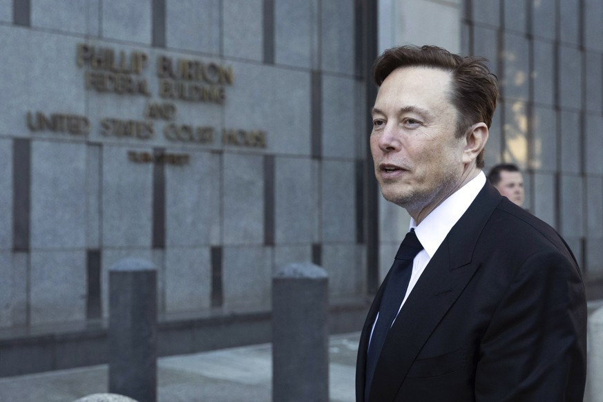 FILE - Elon Musk departs the Phillip Burton Federal Building and United States Court House in San Francisco, on Tuesday, Jan. 24, 2023. Tesla has received requests from the Justice Department for docu ...