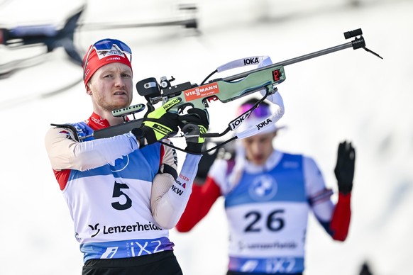 Sebastian Stalder of Switzerland competes at the shooting range during the men&#039;s 10 km sprint race at the IBU Biathlon World Cup, on Friday, December 15, 2023, in Lenzerheide, Switzerland. (KEYST ...