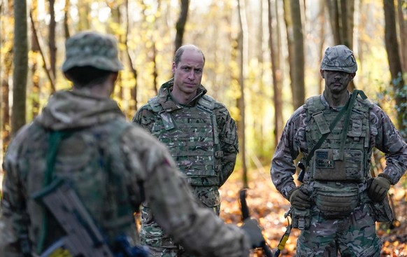 SALISBURY, ENGLAND - NOVEMBER 23: Prince William, Prince of Wales, Colonel-in-Chief, 1st Battalion Mercian Regiment (L) listens to a briefing ahead of an attack exercise during a visit to the regiment ...