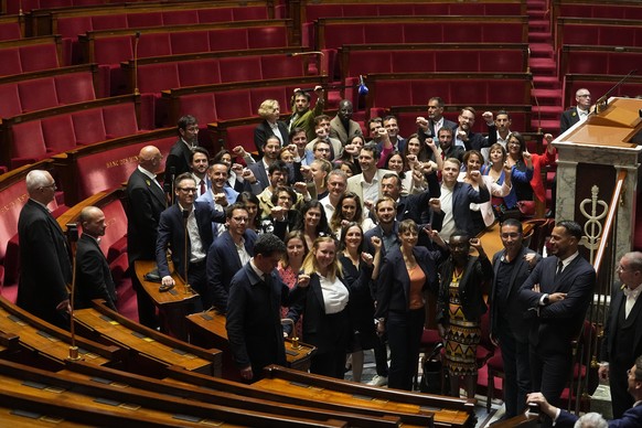 The group of elected parliament members of the far-left La France Insoumise (France Unbowed) party clench their fist inside the National Assembly, Tuesday, July 9, 2024 in Paris. French voters have gi ...