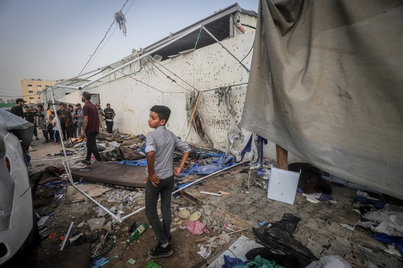 GAZA CITY, GAZA - AUGUST 11: Palestinians inspect the scene after an Israeli airstrike on a journalists&#039; tent near the Al-Shifa Hospital in Gaza City, Gaza on August 11, 2025. Anas al-Sharif, Moh ...