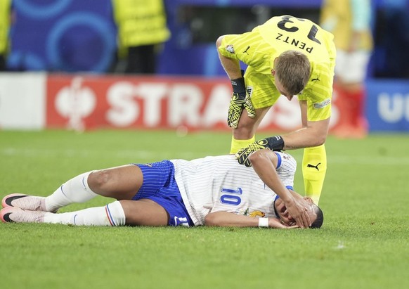 DUSSELDORF, GERMANY - JUNE 17: Kylian Mbappe (10) of France gets injured during the 2024 European Football Championship (EURO 2024) Group D football match between France and Austria at Merkur Spiel-Ar ...
