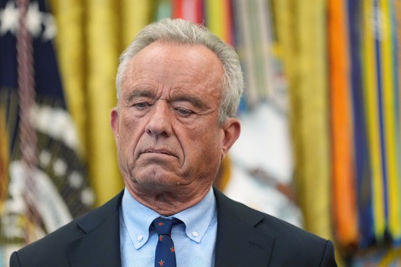 Health and Human Services Secretary Robert F. Kennedy Jr. listens during a meeting to sign an executive order about vaccines, Monday, Aug. 10, 2026, in the Oval Office of the White House in Washington ...