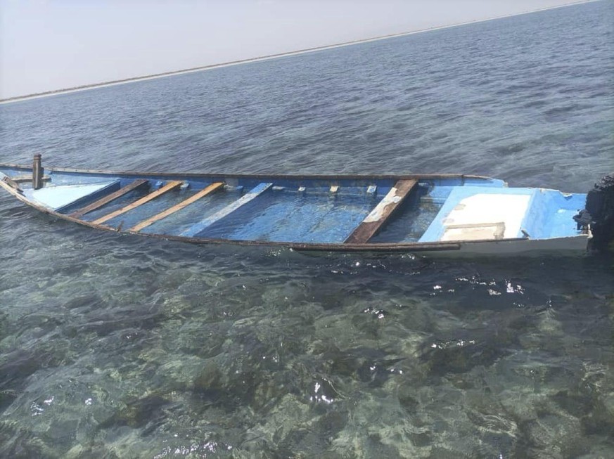 A capsized boat is seen near the coastal town of Obock, in northeastern Djibouti Tuesday, April 9, 2024. The United Nations migration agency says 38 migrants are dead and 22 others have been rescued f ...