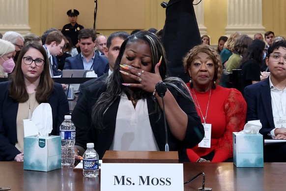 epa10026448 Georgia election worker Shaye Moss (Front) gestures while testifying, as her mother, Georgia election worker Ruby Freeman (Back) looks on, during a public hearing of the House Select Commi ...