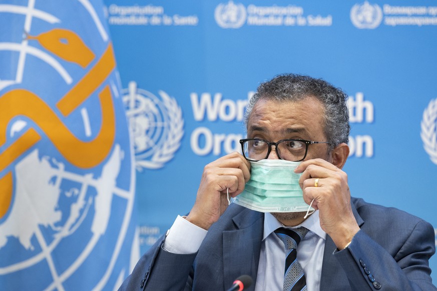 Tedros Adhanom Ghebreyesus, Director General of the World Health Organization (WHO), removes his protective face mask prior talking to the media regarding the coronavirus COVID-19 and WHO?s global hea ...