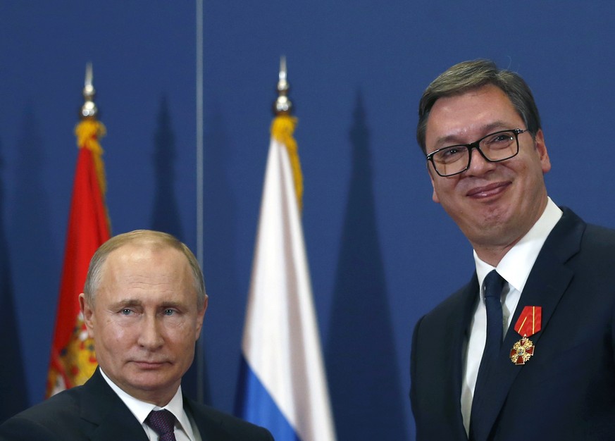 FILE- Russian President Vladimir Putin, left, poses with Serbian President Aleksandar Vucic after being awarded the Order of Alexander Nevsky in Belgrade, Serbia, Thursday, Jan. 17, 2019. Vucic said h ...