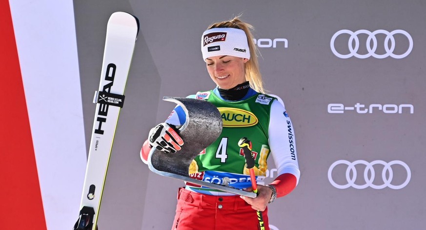epa09541122 Second placed Lara Gut-Behrami of Switzerland celebrates on the podium after the women's giant slalom at the FIS Alpine Ski World Cup season opening in Soelden, Austria, 23 October 2021. E ...