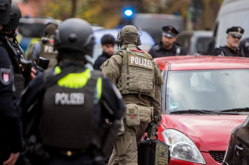 epa10964237 Special police arrives at the area outside a school in Hamburg, Germany, 08 November 2023, after at least one armed person was seen in the school. 'There are currently indications of ...