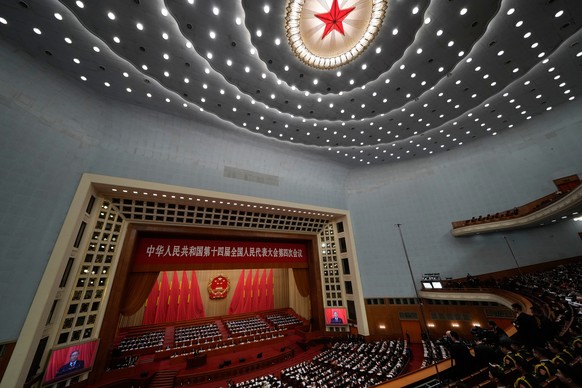 Delegates listen as Chinese Premier Li Qiang speaks during the opening session of the National People's Congress (NPC) in Beijing, Thursday, March 5, 2026. (AP Photo/Ng Han Guan)
APTOPIX China Co ...