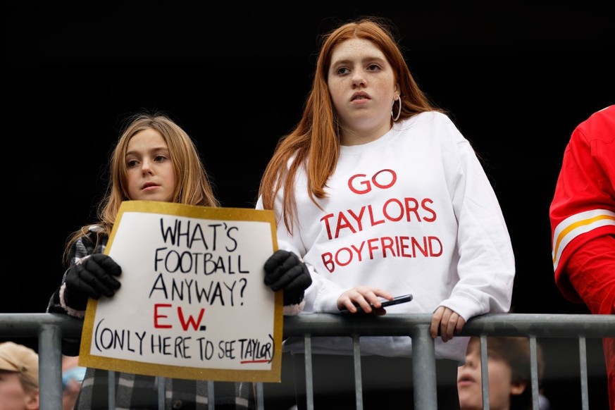 FOXBOROUGH, MASSACHUSETTS - DECEMBER 17: A fan holds a sign referencing Taylor Swift prior to a game between the Kansas City Chiefs and the New England Patriots at Gillette Stadium on December 17, 202 ...