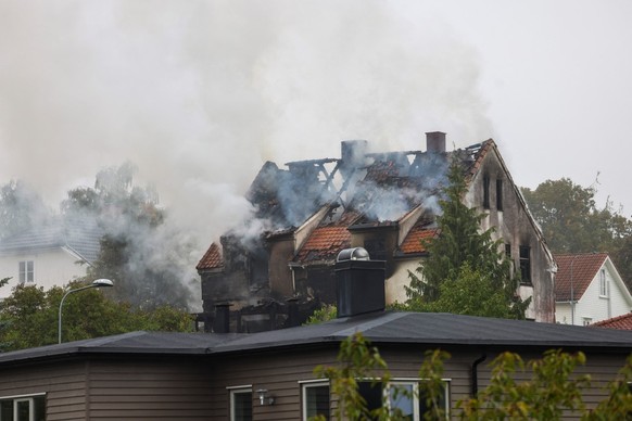 Smoke rises from a building in Hamar, eastern Norway, on September 8, 2025. Three women aged 18