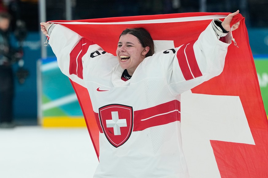 Switzerland's Andrea Braendli (20) celebrates after a women's ice hockey bronze medal game between Switzerland and Sweden at the 2026 Winter Olympics, in Milan, Italy, Thursday, Feb. 19, 202 ...