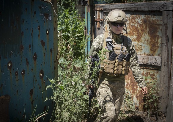 Ukrainian platoon commander Mariia walks in a position in the Donetsk region, Ukraine, Saturday, July 2, 2022. Ukrainian soldiers returning from the frontlines in eastern UkraineÄôs Donbas region des ...