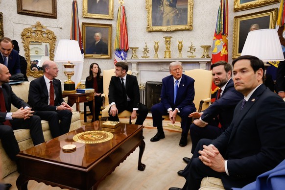 epa11922036 US President Donald Trump (C-R) meets with French President Emmanuel Macron (C-L) at the Oval Office of the White House in Washington, DC, USA, 24 February 2025. EPA/LUDOVIC MARIN / POOL