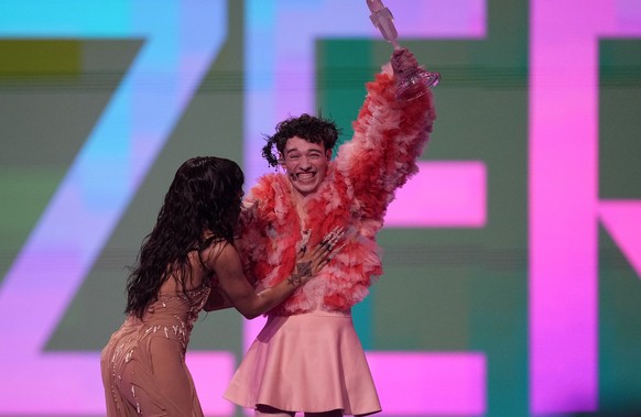 Nemo of Switzerland, who performed the song The Code, celebrates with last year&#039;s winner Loreen of Sweden after winning the Grand Final of the Eurovision Song Contest in Malmo, Sweden, Saturday,  ...