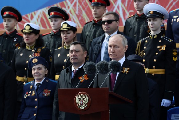epa10616636 Russian President Vladimir Putin (C) delivers his speech during a Victory Day military parade on Red Square in Moscow, Russia, 09 May 2023. Russia marks the 78th anniversary of the victory ...