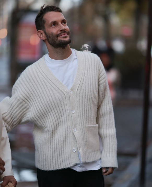 PARIS, FRANCE - SEPTEMBER 26: Simon Porte Jacquemus seen wearing a total Jacquemus look, outside Jacquemus store opening during fashion week in Paris on September 26, 2022 in Paris, France. (Photo by  ...