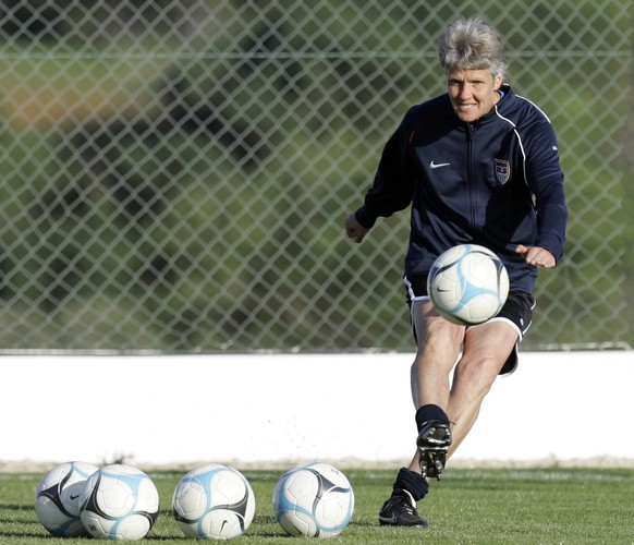 Head coach for the U.S. women&#039;s soccer team Pia Sundhage, from Sweden, kicks a ball during a training session in Montechoro, Portugal, Sunday, March 9 2008. The U.S. team defeated Italy 2-0 Frida ...