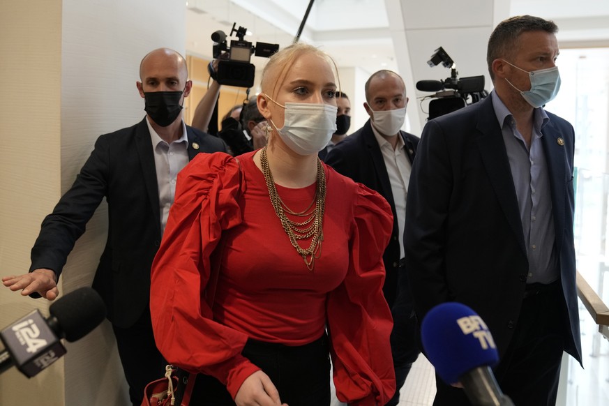 The teenager identifying herself online as Mila leaves at the courtroom Thursday, June 3, 2021 in Paris. Thirteen people went on trial Thursday in Paris accused of cyberbullying or death threats again ...