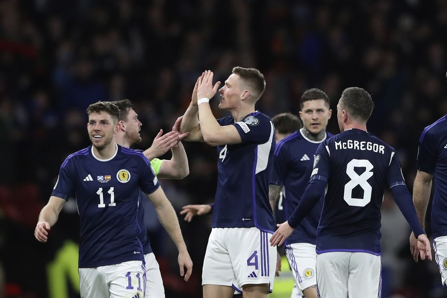 Scotland&#039;s Scott McTominay, third from left, celebrates with his teammates after scoring his side&#039;s second goal during the Euro 2024 group A qualifying soccer match between Scotland and Spai ...