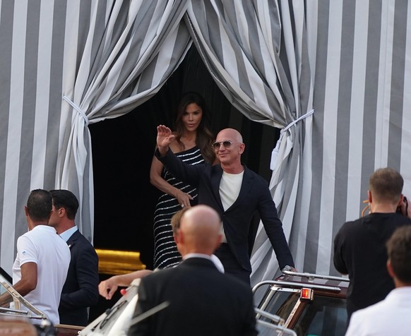 epaselect epa12197515 Amazon founder Jeff Bezos (C-R) and his fiancee Lauren Sanchez (C-L) leave the Aman Hotel in Venice, Italy, 25 June 2025, one day before their wedding celebrations are to begin.  ...