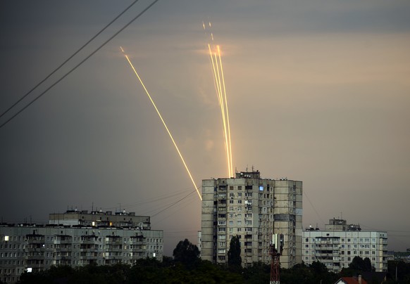 Russian rockets launch against Ukraine from Russia&#039;s Belgorod region are seen at dawn in Kharkiv, Ukraine, Monday, Aug. 15, 2022. (AP Photo/Vadim Belikov)
