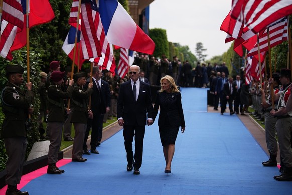 epa11393179 President Joe Biden and First Lady Jill Biden leave after a commemorative ceremony to mark D-Day 80th anniversary, at the US cemetery in Colleville-sur-Mer, Normandy, France, 06 June 2024. ...