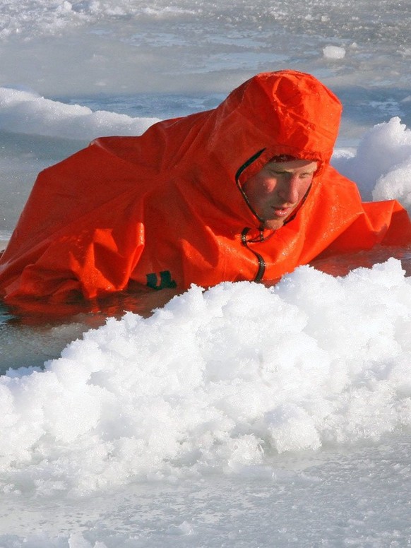 Britain&#039;s Prince Harry tries out an immersion suit, during training for the Walking with the Wounded expedition, on the island of Spitsbergen, situated between the Norwegian mainland and the Nort ...