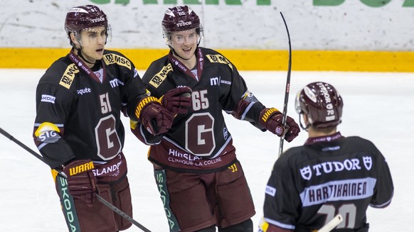 L&#039;attaquant genevois Valtteri Filppula, l&#039;attaquant genevois Sakari Manninen et l&#039;attaquant genevois Teemu Hartikainen, de gauche a droite, laissent eclater leur joie, lors du match du  ...