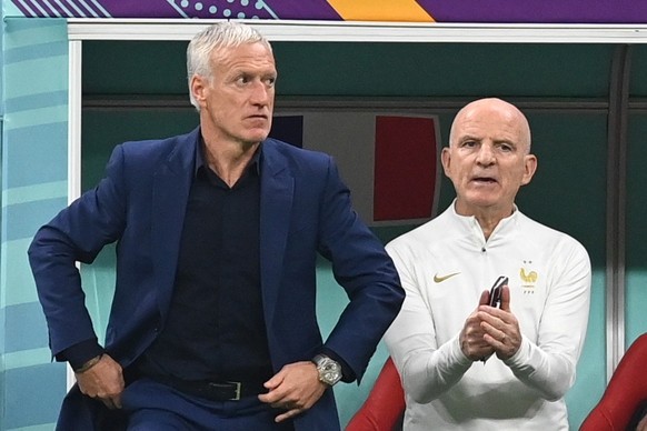 epa10365908 Head coach Didier Deschamps (L) of France and his assisstant Guy Stephan react during the FIFA World Cup 2022 semi final between France and Morocco at Al Bayt Stadium in Al Khor, Qatar, 14 ...