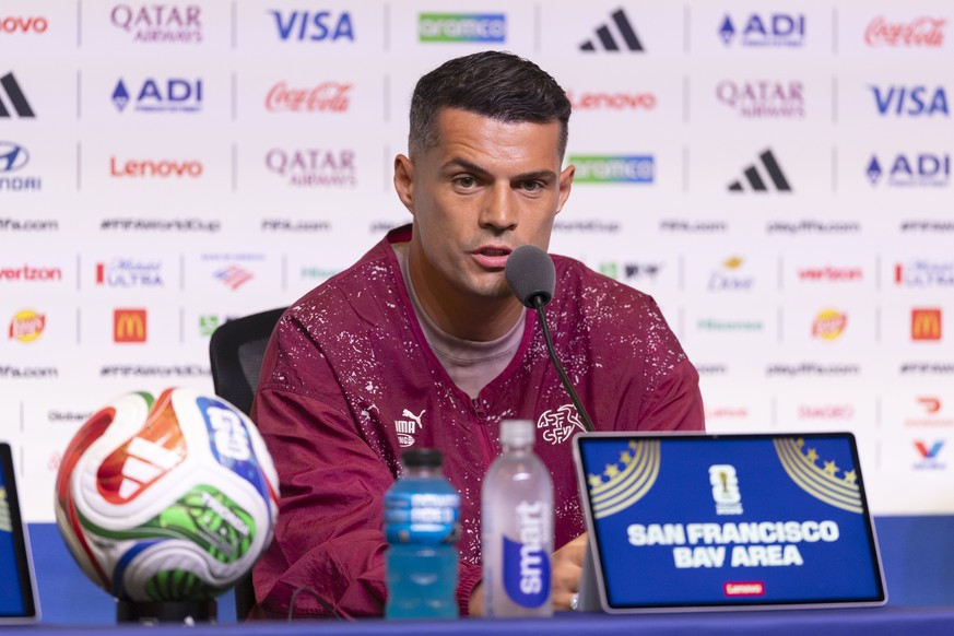 epa13033790 Switzerland's captain Granit Xhaka speaks during a press conference on the eve of the FIFA World Cup 2026 Group B soccer match between Qatar and Switzerland in Santa Clara, California ...