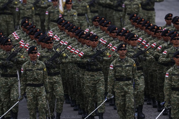 epa12237283 Indonesian army parade during the Bastille day celebrations in Paris, France, 14 July 2025. France celebrates its national holiday, or Bastille Day, annually on 14 July to commemorate the  ...