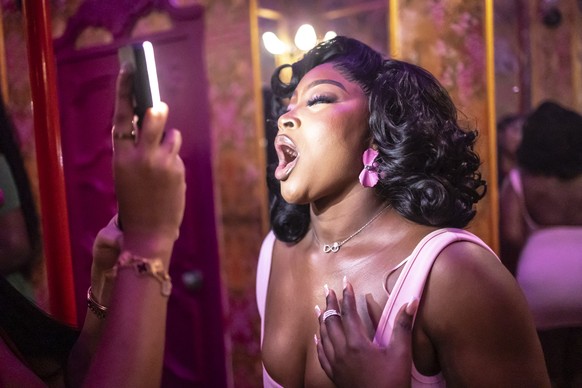 A patron poses for a photograph in a decorated selfie space inside the restroom of Zaza restaurant and lounge in Lagos, on August 23, 2025. In Nigeria, bathroom selfies are no joke.
From the buzzing m ...