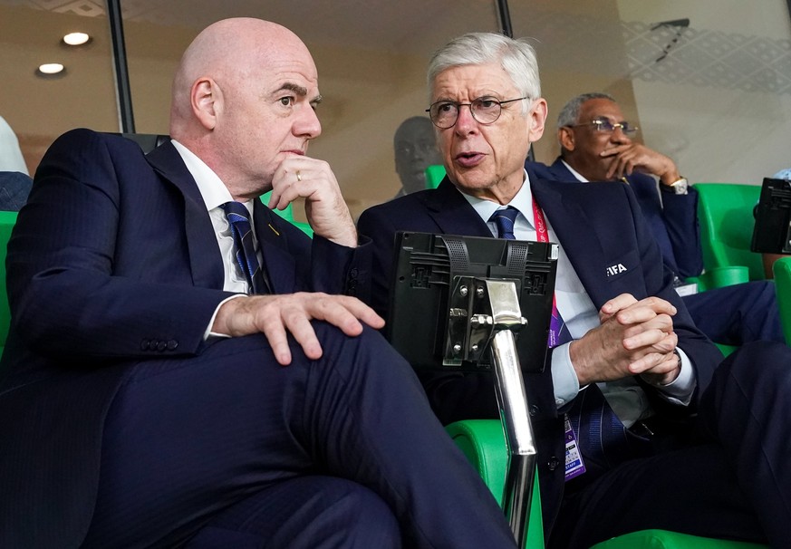DOHA, QATAR - NOVEMBER 21: FIFA President Gianni Infantino (L) with FIFA Chief of Global Football Development Arsène Wenger during the FIFA World Cup Qatar 2022 Group A match between Senegal and Nethe ...
