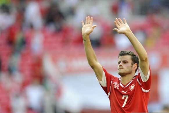 Swiss midfielder Tranquillo Barnetta cheers with supporters after a UEFA European Championship Euro 2012 qualifying group match between England and Switzerland at Wembley Stadium, in London, England,  ...