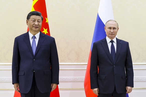 Chinese President Xi Jinping, left, and Russian President Vladimir Putin pose for a photo on the sidelines of the Shanghai Cooperation Organization (SCO) summit in Samarkand, Uzbekistan, Thursday, Sep ...