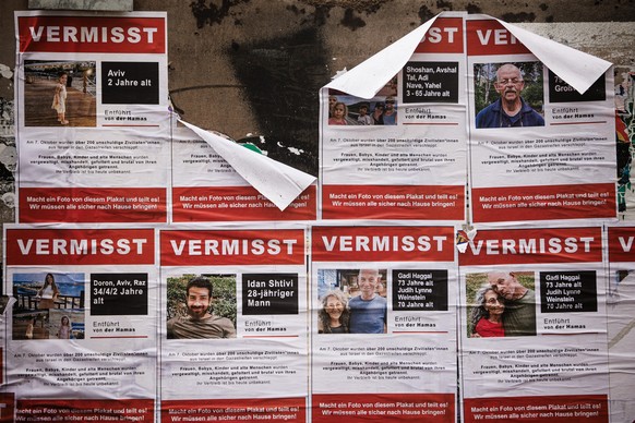 epa10938139 Fliers showing currently missing people who were kidnapped by Hamas in Israel, are pasted on a wall at a construction site in Berlin, Germany, 25 October 2023. According to the Israel Defe ...