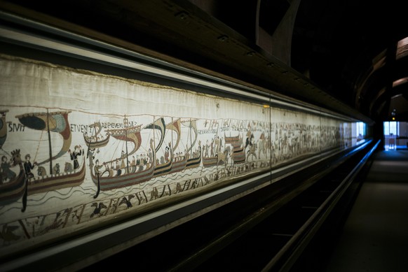 FILE - This photo taken Wednesday, Sept. 18, 2019 shows the 11th century Bayeux tapestry chronicling the Norman conquest of England, in Bayeux, Normandy, France. (AP Photo/Kamil Zihnioglu, File)
Brita ...