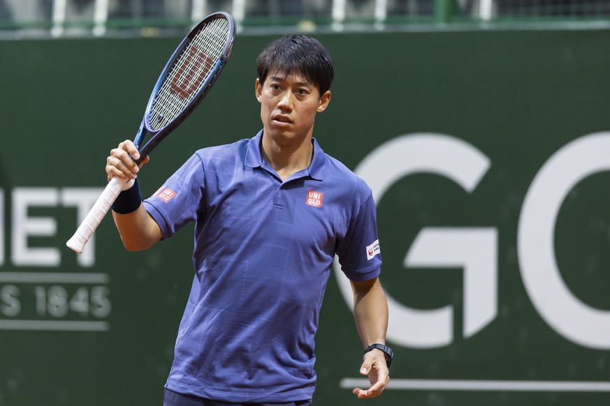 epa12120625 Kei Nishikori of Japan in action against Karen Khachanov of Russia during their round of 16 match at the Geneva Open tennis tournament, in Geneva, Switzerland, 20 May 2025. EPA/CYRIL ZINGA ...