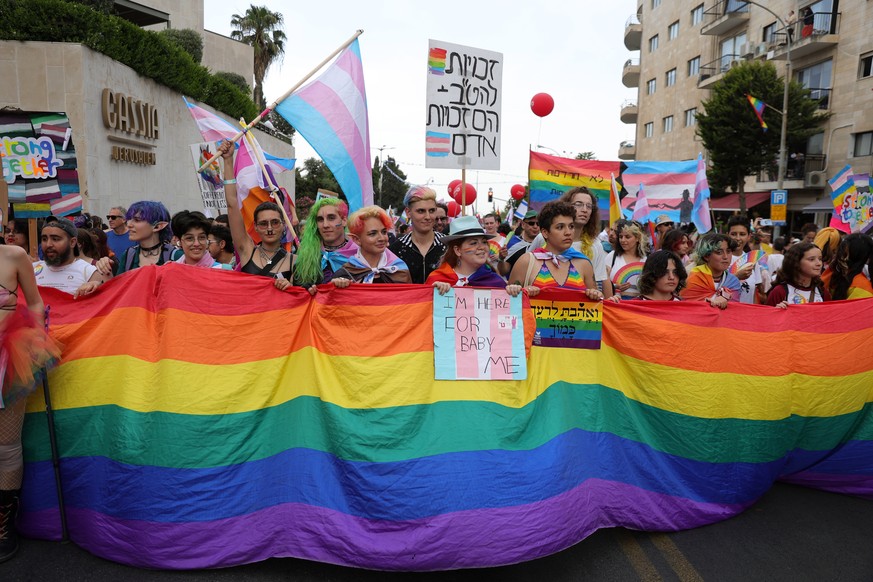 epa10667131 Participants march during the annual Gay Pride parade in Jerusalem, 01 June 2023. Thousands of members and supporters of the LGBTQ (lesbian, gay, bisexual, transgender, intersex, queer) co ...