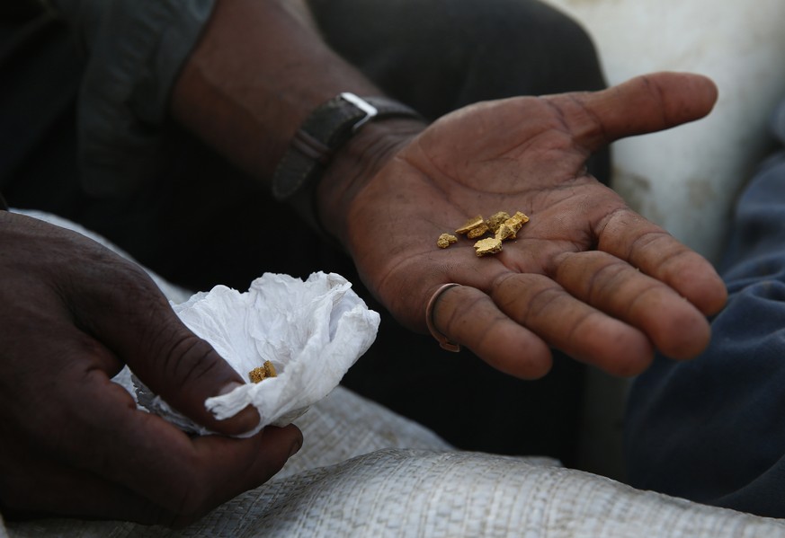 A miner shows gold he extracted illegally as he leaves the Yanomami Indigenous territory ahead of expected operations against illegal mining in Alto Alegre, Roraima state, Brazil, Tuesday, Feb. 7, 202 ...