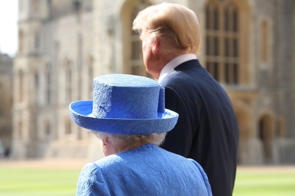 WINDSOR, ENGLAND - JULY 13: Queen Elizabeth II and President of the United States, Donald Trump walk from the Quadrangle after inspecting an honour guard at Windsor Castle on July 13, 2018 in Windsor, ...