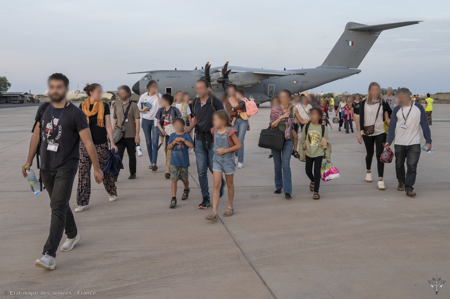 French soldiers evacuate French citizens in Djibouti, Sunday, April 23, 2023. Two French military planes evacuating about 200 people from multiple countries left Khartoum on Sunday for Djibouti as Fra ...