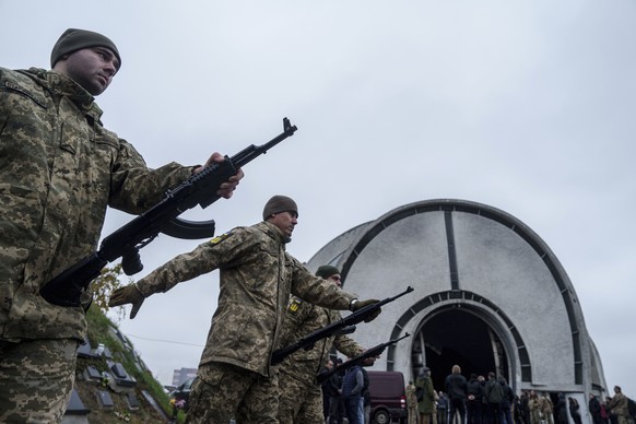Honour Guard prepares to fire into the air during the funeral ceremony of Ukrainian serviceman of 3rd assault brigade Danylo Liashkevych aka &quot;Berserk&quot; and his girlfriend Valentyna Nagorna ak ...