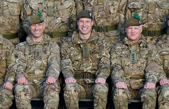 SALISBURY, ENGLAND - NOVEMBER 23: Prince William, Prince of Wales, Colonel-in-Chief, 1st Battalion Mercian Regiment (L) listens to a briefing ahead of an attack exercise during a visit to the regiment ...