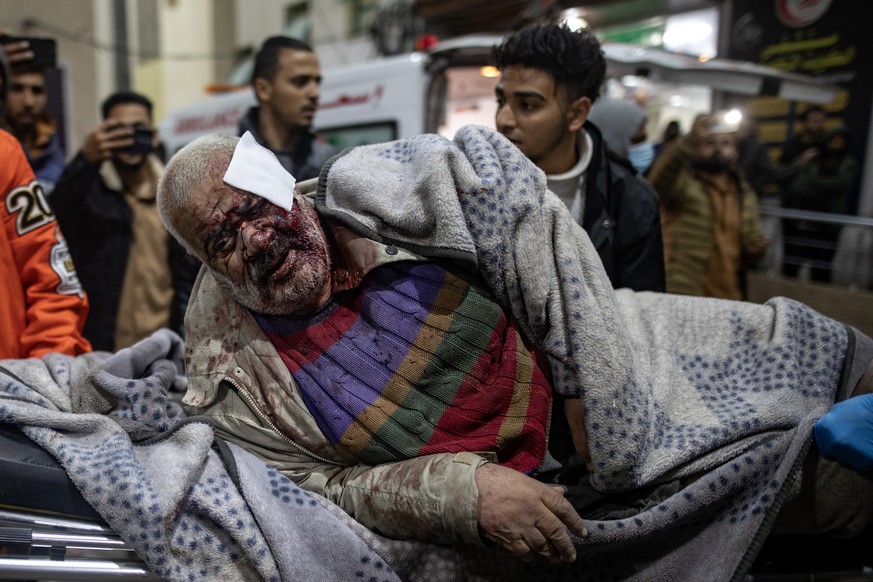 epa11146669 Wounded people are transported to Kuwait Hospital in Rafah, southern Gaza Strip, 12 February 2024, following Israeli air strikes on the Rafah refugee camp in the southern Gaza Strip. Accor ...