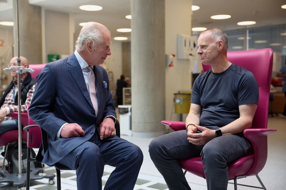 LONDON, ENGLAND - APRIL 30: King Charles III meets with patient Huw Stiley during a visit to the University College Hospital Macmillan Cancer Centre on April 30, 2024 in London, England. (Photo by Suz ...