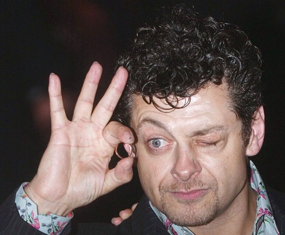 Actor Andy Serkis views photographers through a ring as he arrives for the British premiere of The Lord Of The Rings : The Return Of The King at The Odeon, Leicester Square, London Thursday Dec. 11, 2 ...