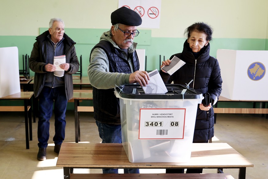 epa11884184 People vote for the parliamentary elections at the polling station in primary school &quot;King Milutin&quot; in Gracanica, Kosovo, 09 February 2025. About two million voters are eligible  ...